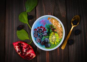 Healthy fruit bowl with blue soja yogurt